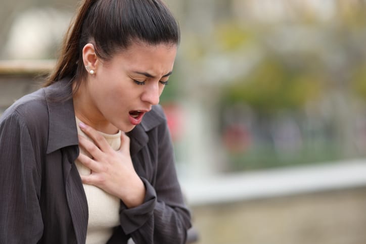 Photo shows woman having breathing problems