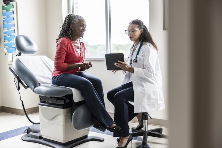 Photo shows woman with doctor