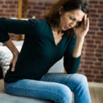 Woman With Back Pain And Ache