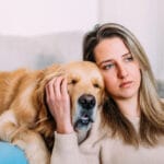 Young woman with dog at home