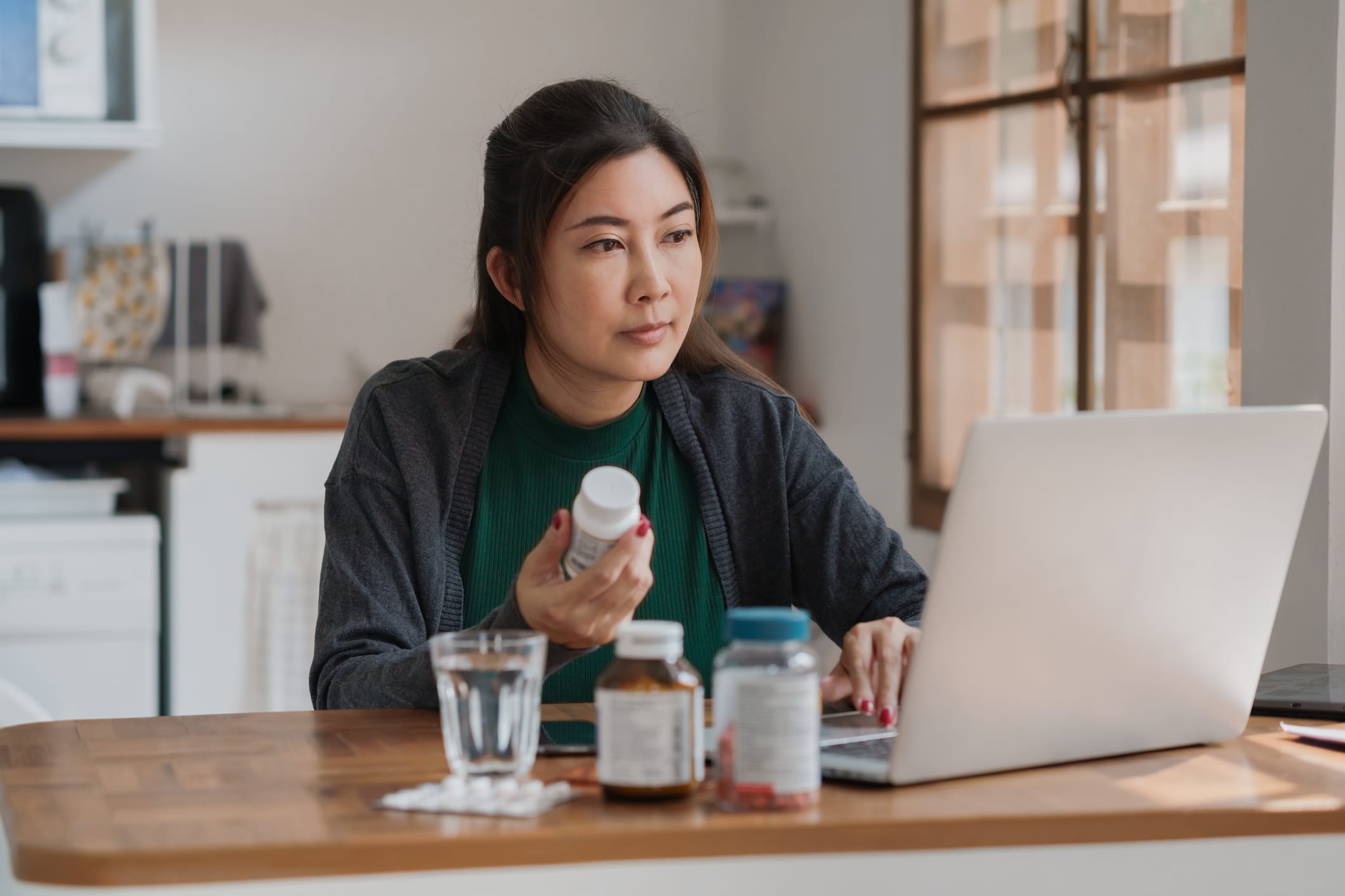Patient researching medications on laptop
