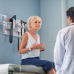 Older woman speaking with a doctor at a medical appointment