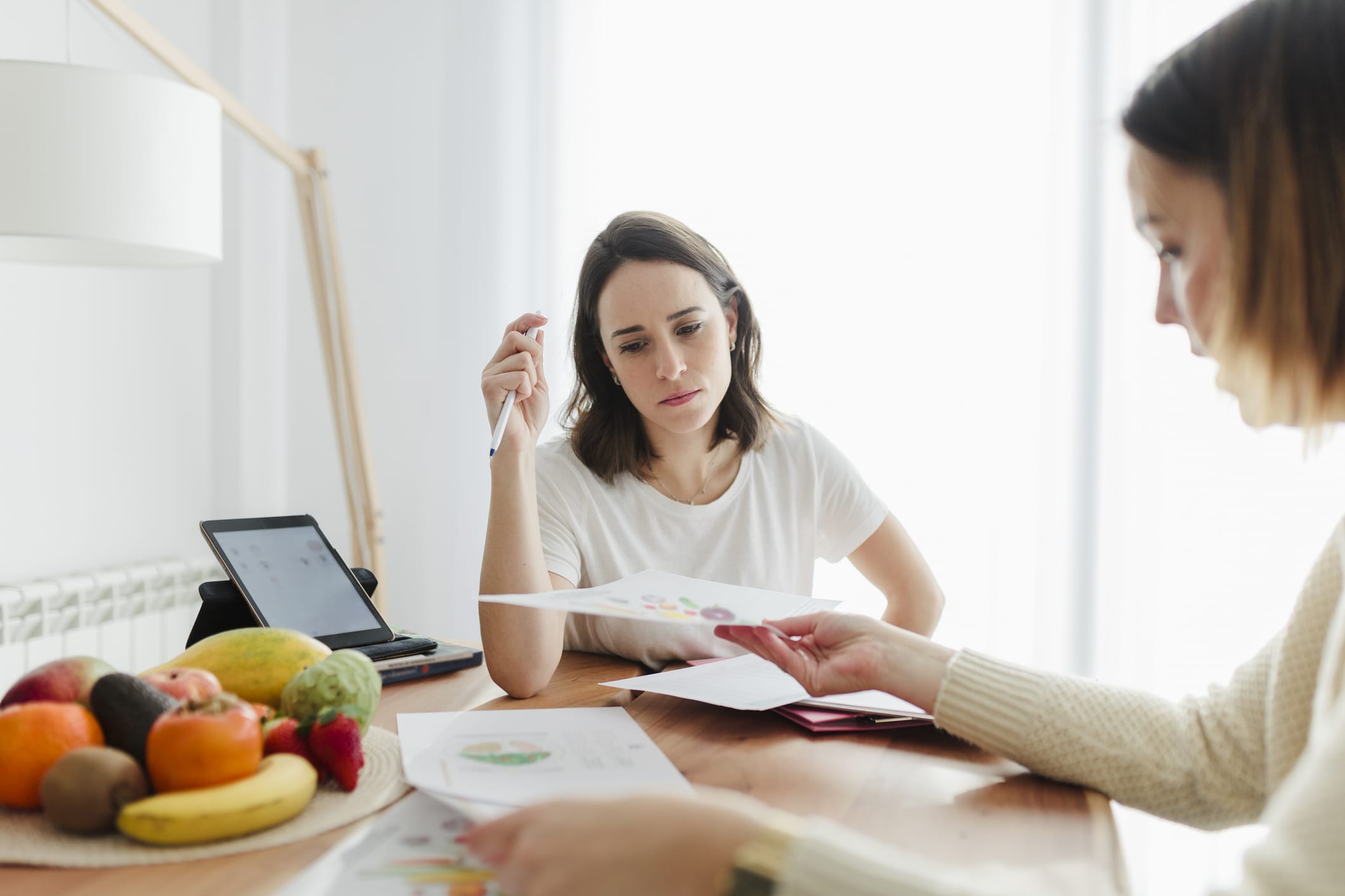 Dietician explaining foods to a client