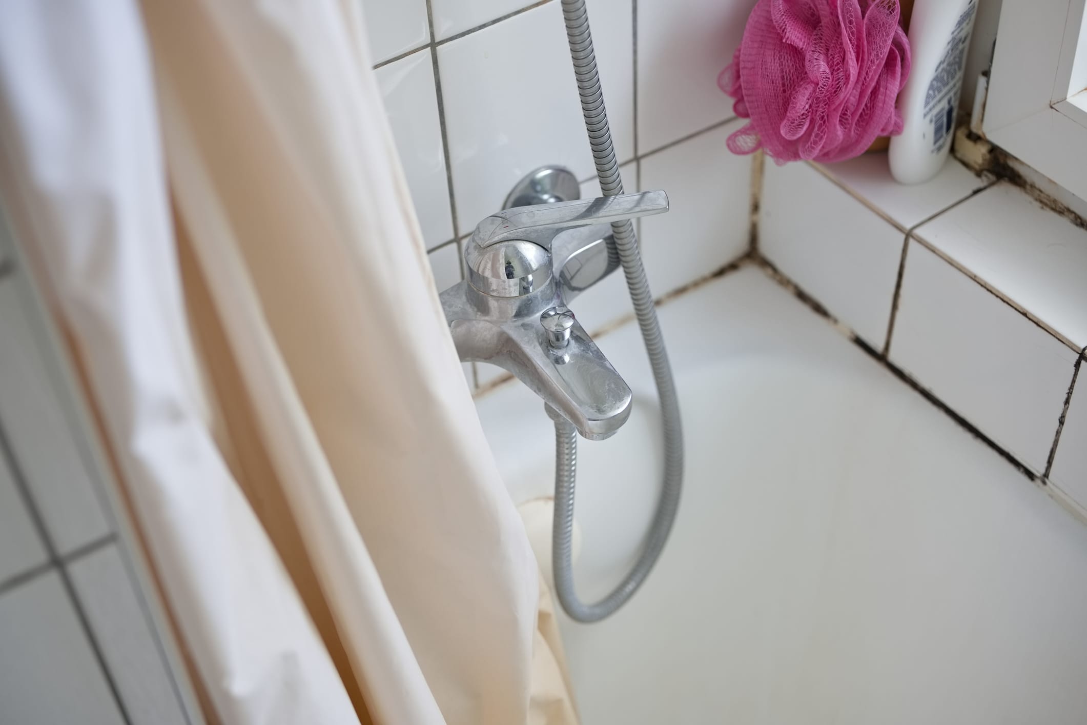 Moldy grout in a tub