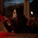 Woman scrolling endlessly on her mobile phone.