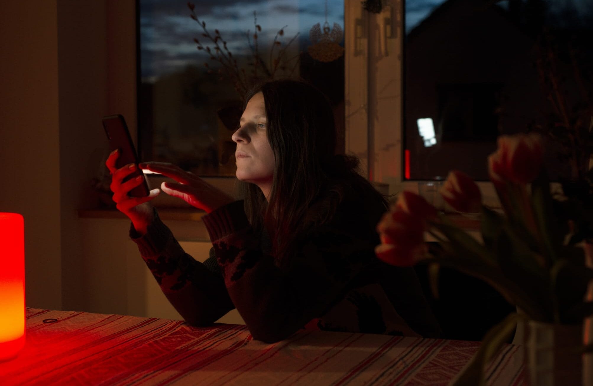 Woman scrolling endlessly on her mobile phone.