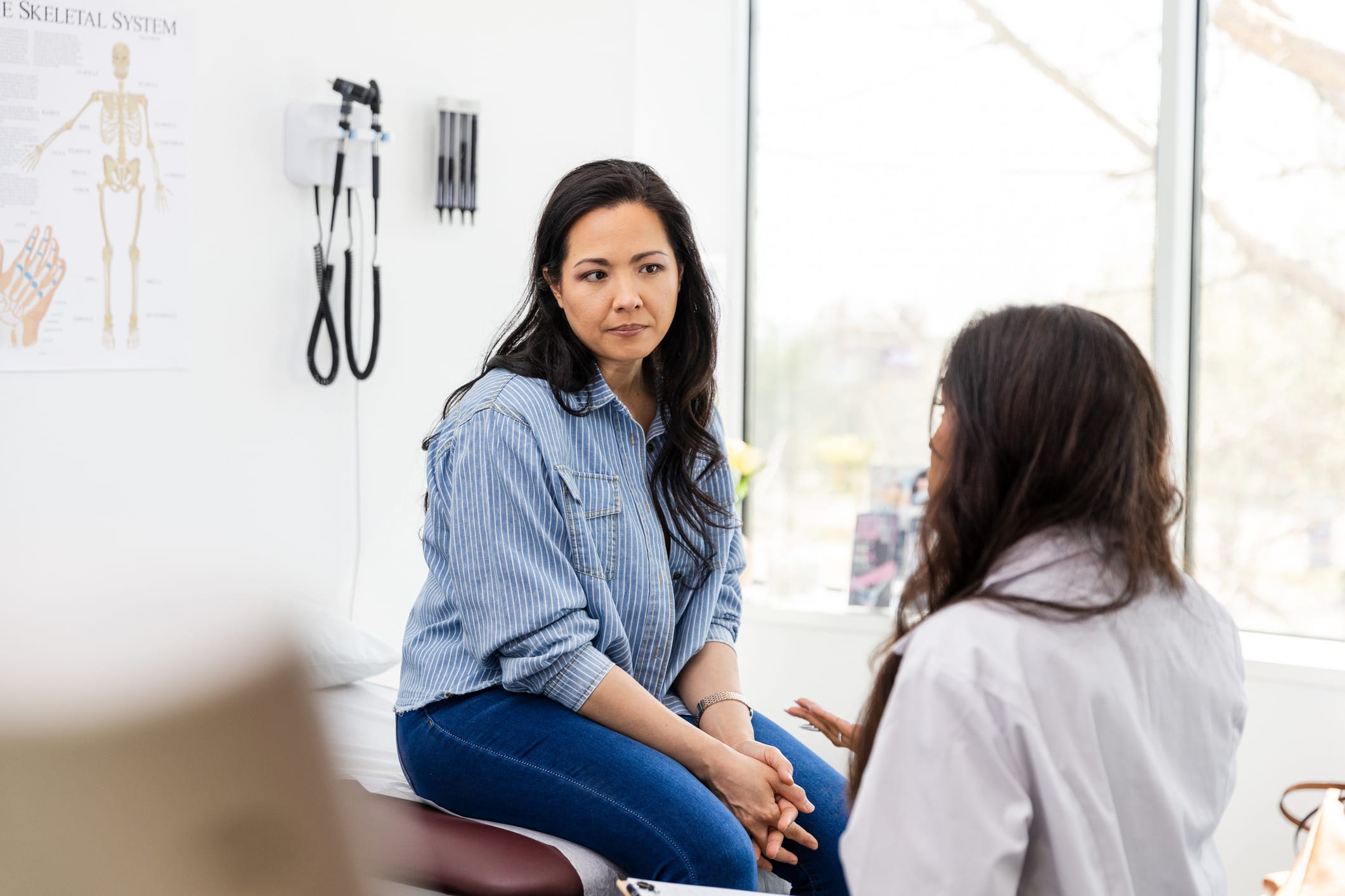 Middle-aged woman speaking to her doctor at an appointment
