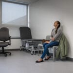 A woman sitting in a doctors office