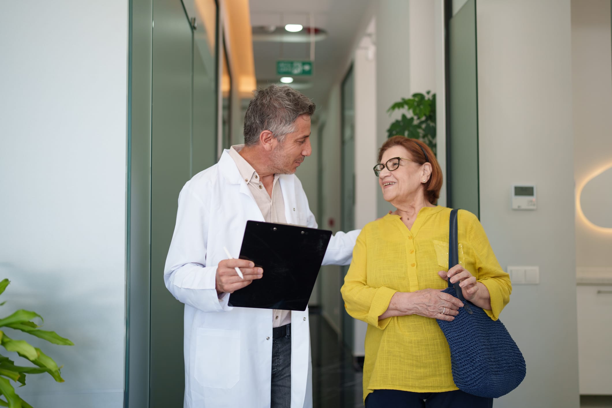 Doctor and patient walking side-by-side