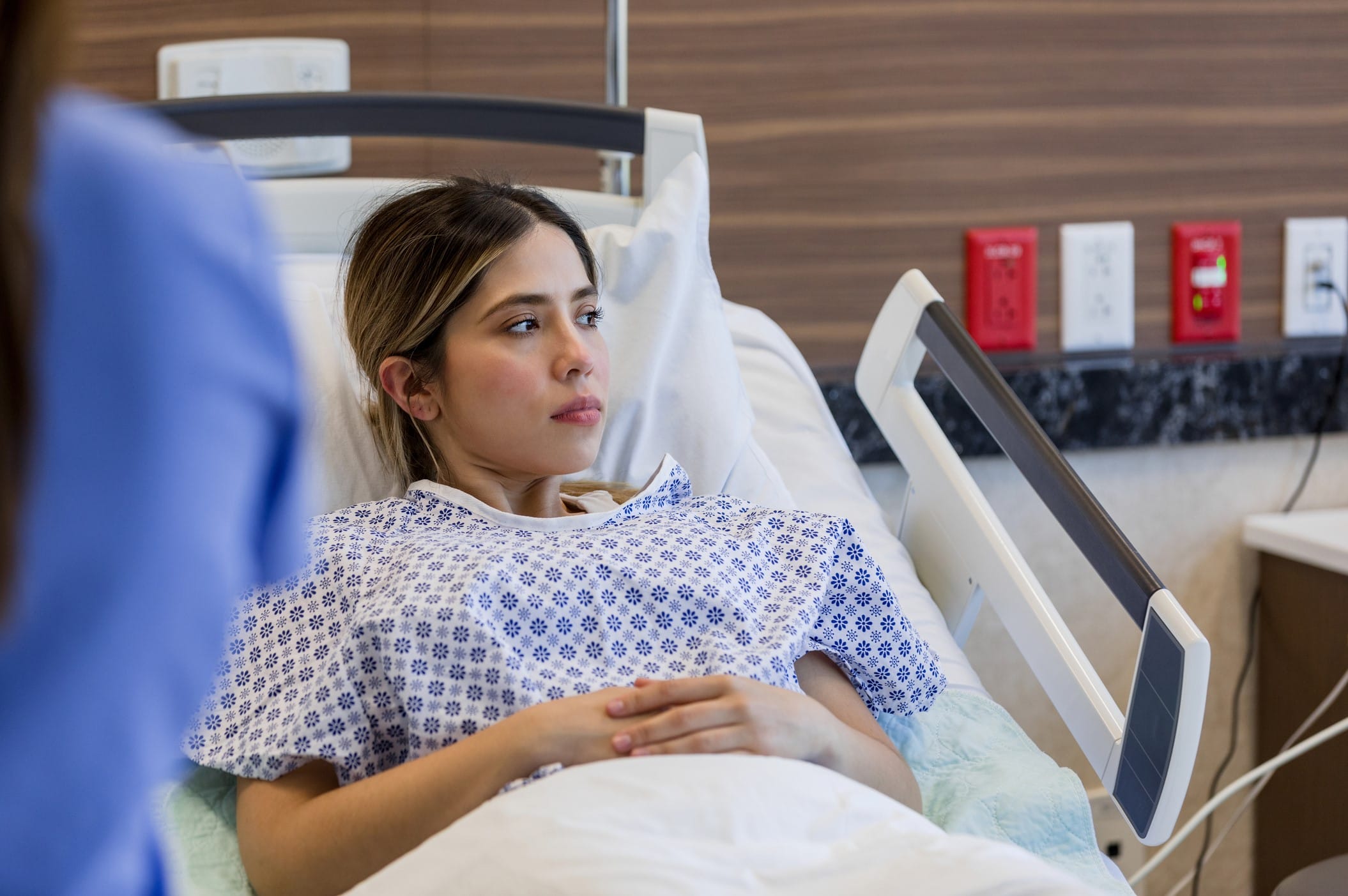Young woman in a hospital bed